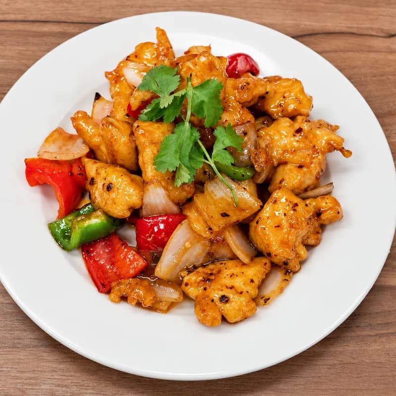 Sweet and sour chicken with peppers and onion
